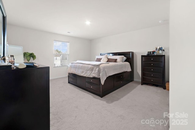 bedroom with light colored carpet