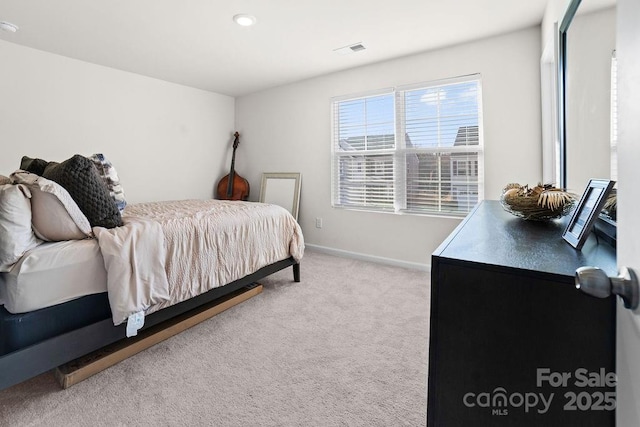 bedroom with light colored carpet