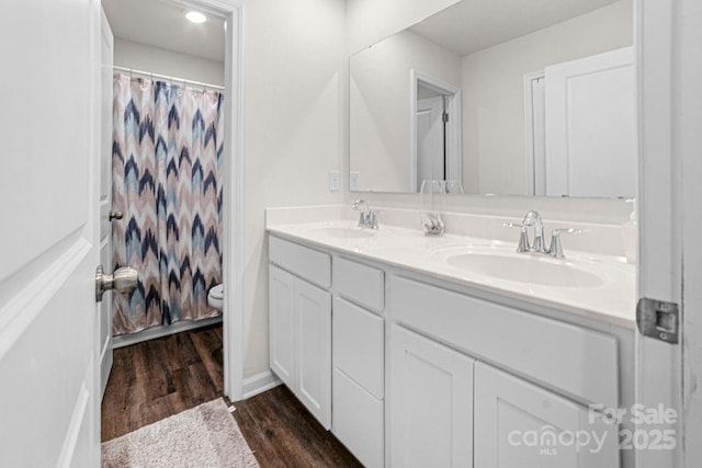 bathroom with vanity, hardwood / wood-style flooring, toilet, and a shower with shower curtain