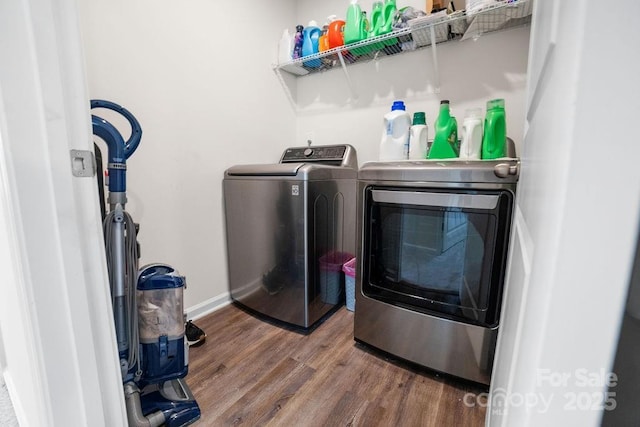 laundry room featuring hardwood / wood-style flooring and independent washer and dryer