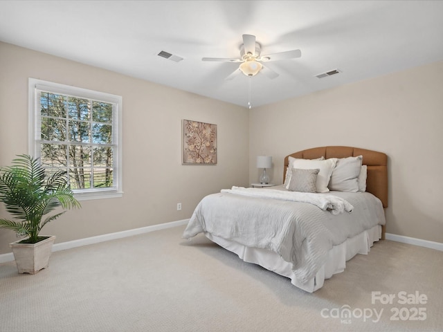 bedroom featuring ceiling fan and light colored carpet