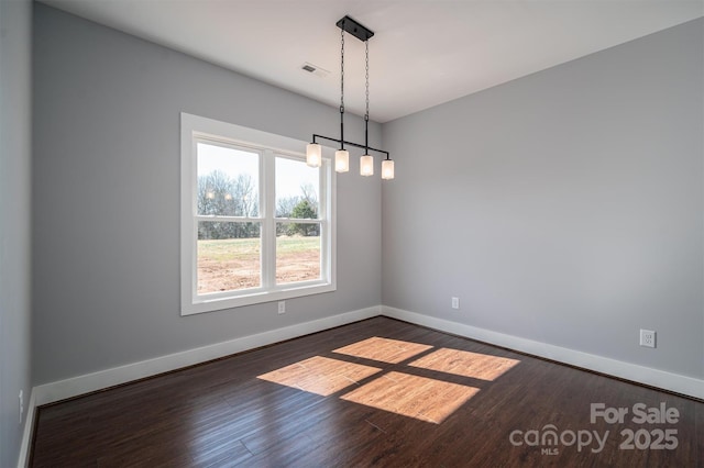 empty room with dark hardwood / wood-style floors