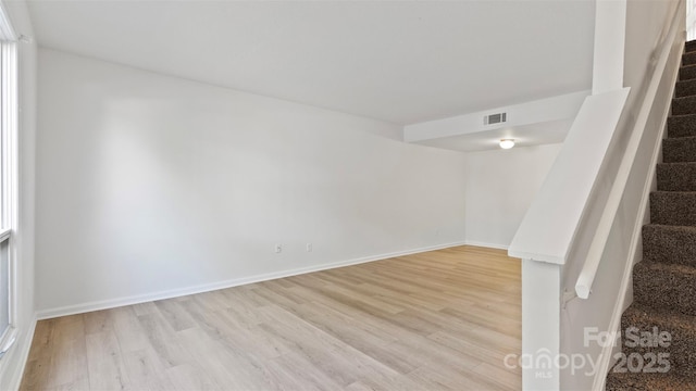 unfurnished room with light hardwood / wood-style floors