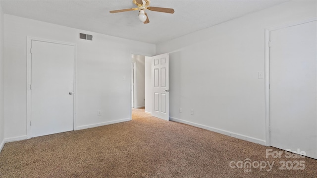 unfurnished bedroom with carpet flooring and ceiling fan