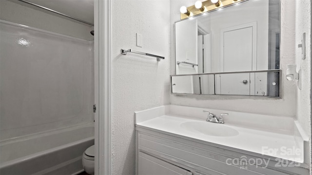 full bathroom featuring tub / shower combination, vanity, and toilet