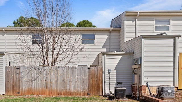 back of property featuring cooling unit