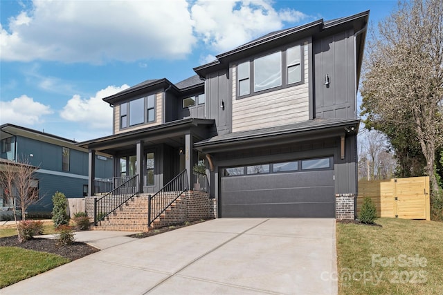 view of front of property with a garage, covered porch, brick siding, driveway, and board and batten siding