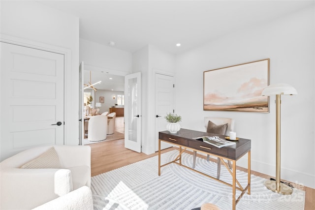 office area with baseboards, light wood-style flooring, and recessed lighting