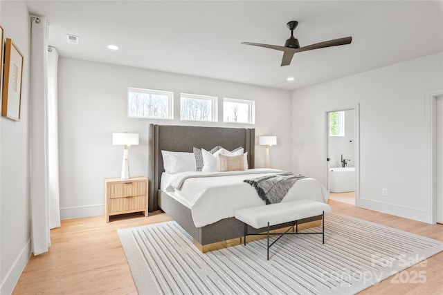 bedroom featuring recessed lighting, visible vents, ensuite bath, light wood-type flooring, and baseboards