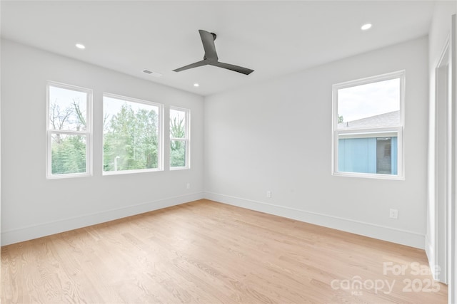 spare room featuring recessed lighting, visible vents, light wood-style flooring, and baseboards