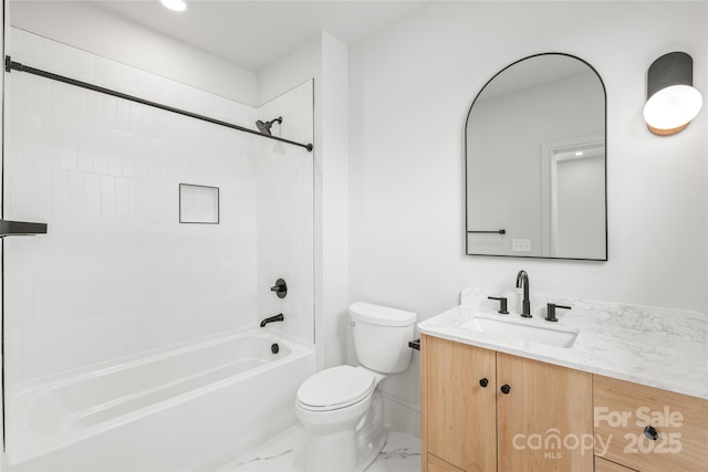 bathroom featuring toilet, marble finish floor, bathing tub / shower combination, and vanity