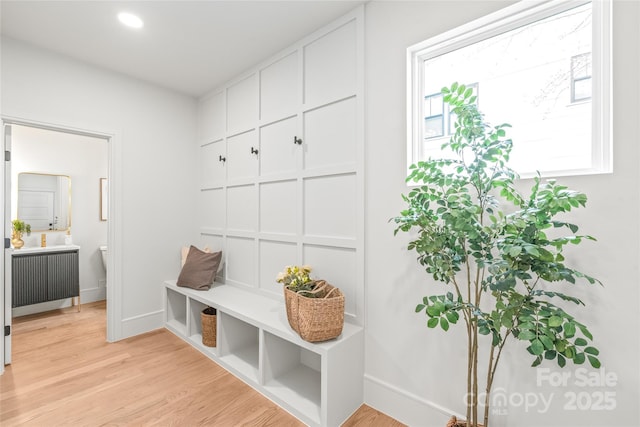 mudroom featuring light wood-type flooring, baseboards, and recessed lighting