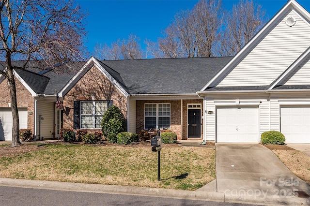 view of front of house featuring a front yard and a garage