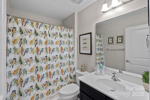 full bathroom featuring curtained shower, visible vents, vanity, and toilet