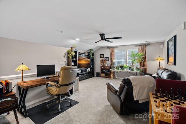 home office with light carpet, ceiling fan, and vaulted ceiling