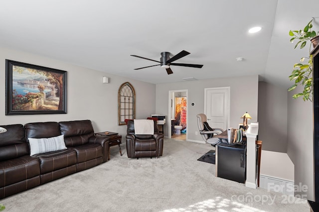 living room with carpet flooring, ceiling fan, and baseboards