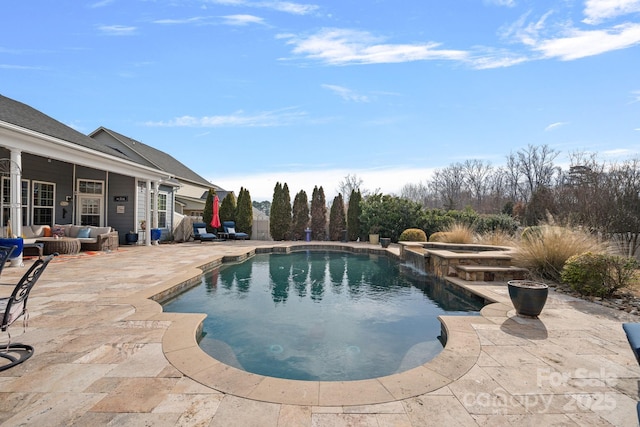 view of pool with an outdoor hangout area, a patio, and a pool with connected hot tub