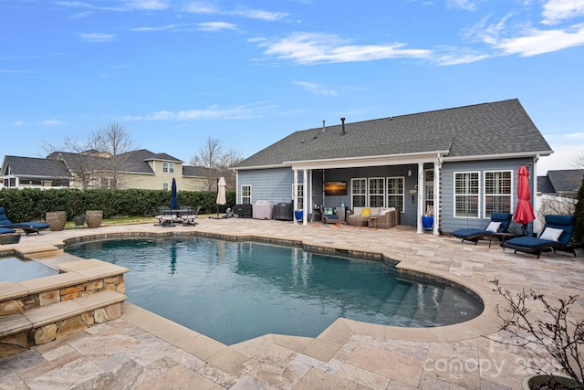 view of swimming pool featuring a fenced in pool, a patio area, and an outdoor living space