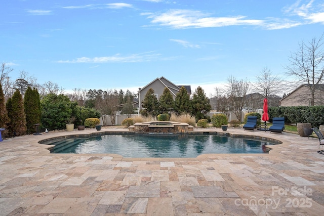 view of swimming pool with a patio and a pool with connected hot tub