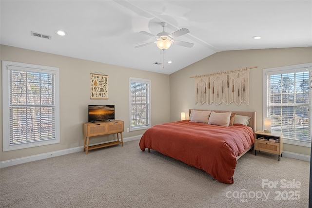 carpeted bedroom with lofted ceiling and ceiling fan