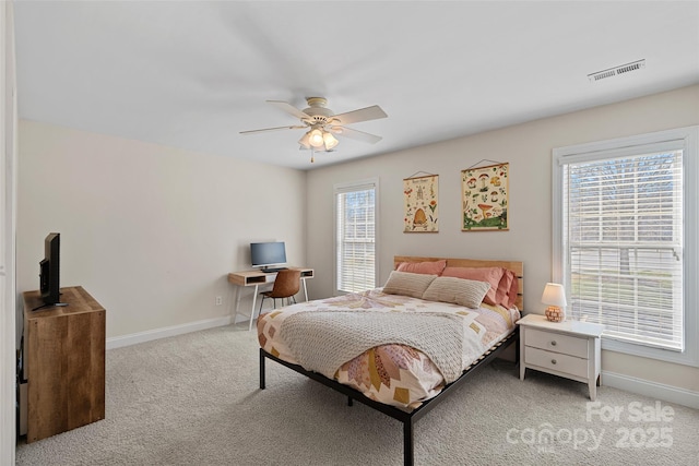 bedroom with light carpet and ceiling fan