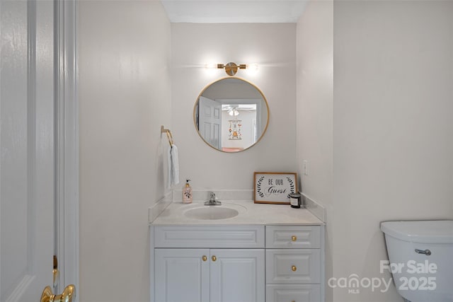 bathroom with vanity and toilet