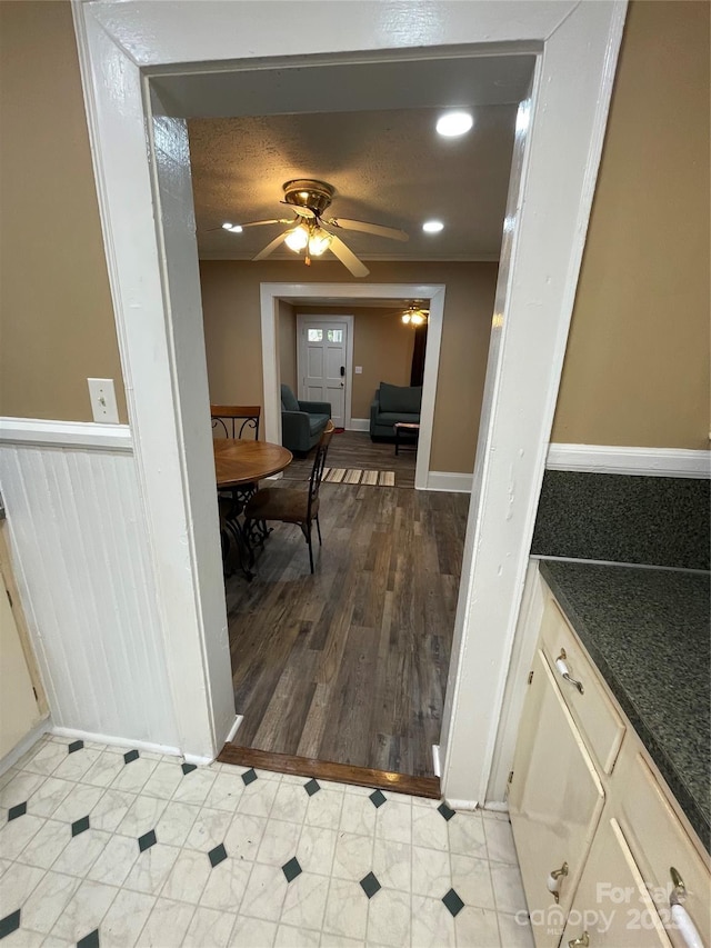 dining area with a wainscoted wall, ceiling fan, and recessed lighting