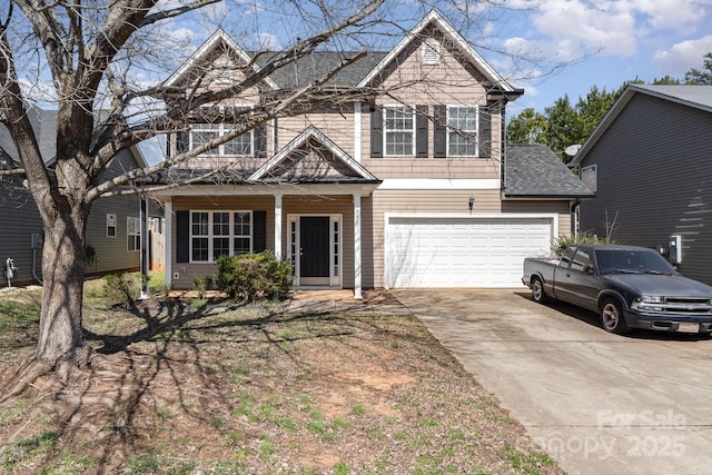 traditional home with concrete driveway and an attached garage