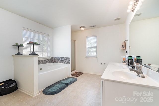 bathroom featuring a sink, visible vents, a garden tub, and a shower stall