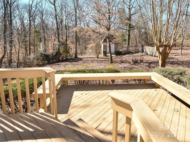 wooden terrace with a storage unit