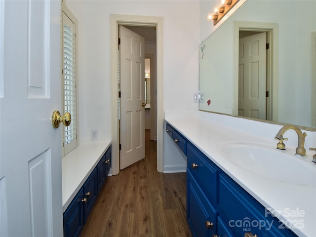 bathroom with vanity and hardwood / wood-style floors