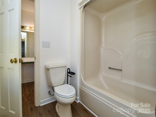 bathroom with wood-type flooring and toilet