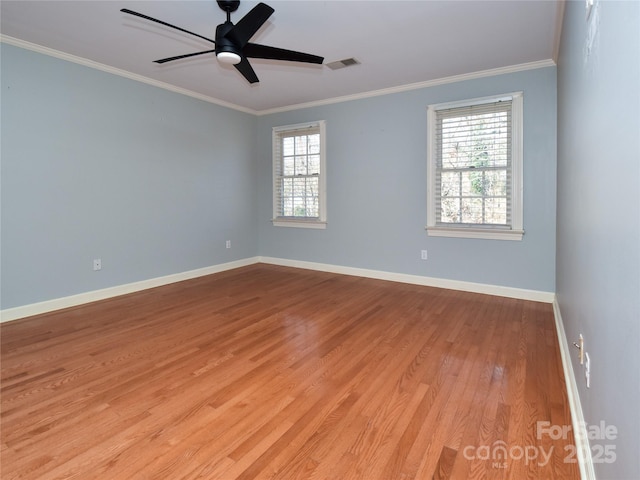 empty room with ceiling fan, light hardwood / wood-style flooring, and crown molding