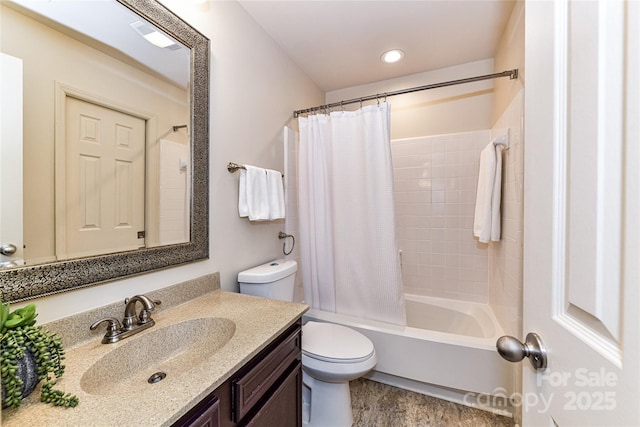 bathroom featuring vanity, shower / tub combo, and toilet