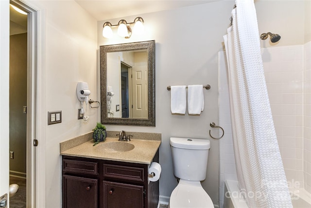 bathroom featuring vanity, toilet, and shower / tub combo with curtain