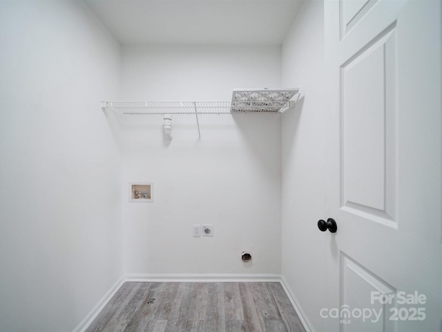 clothes washing area featuring hardwood / wood-style floors, washer hookup, and electric dryer hookup