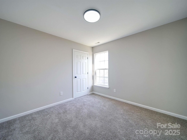 unfurnished room with carpet floors