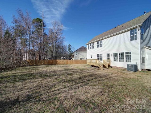 back of house featuring a deck, a yard, and cooling unit