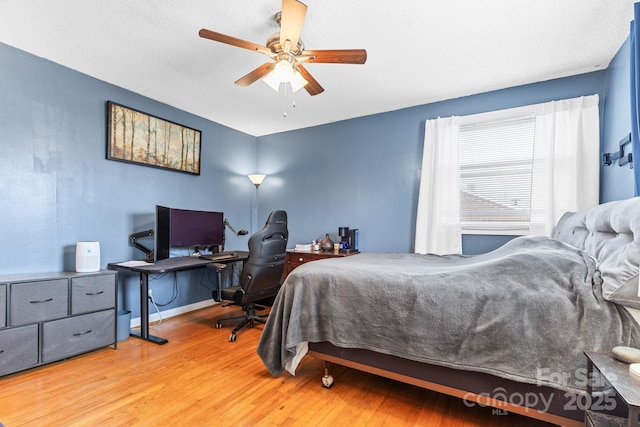 bedroom featuring ceiling fan and wood-type flooring