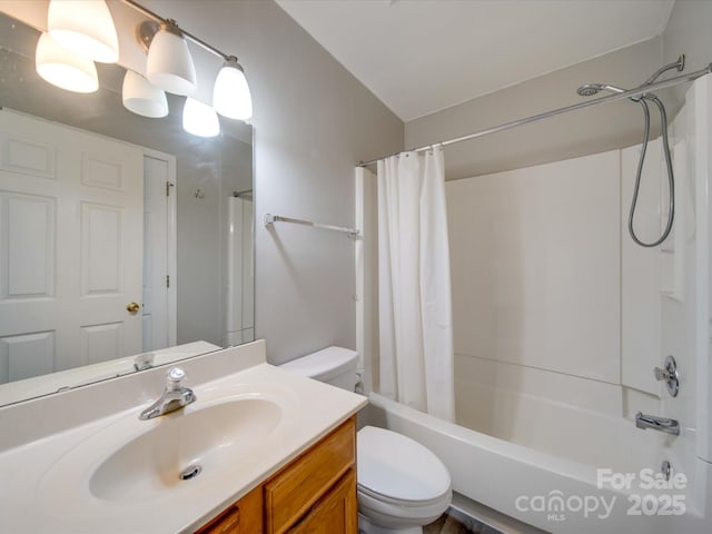 full bath with shower / tub combo, vanity, and toilet