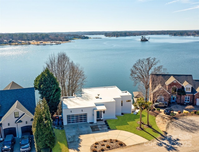 birds eye view of property with a water view