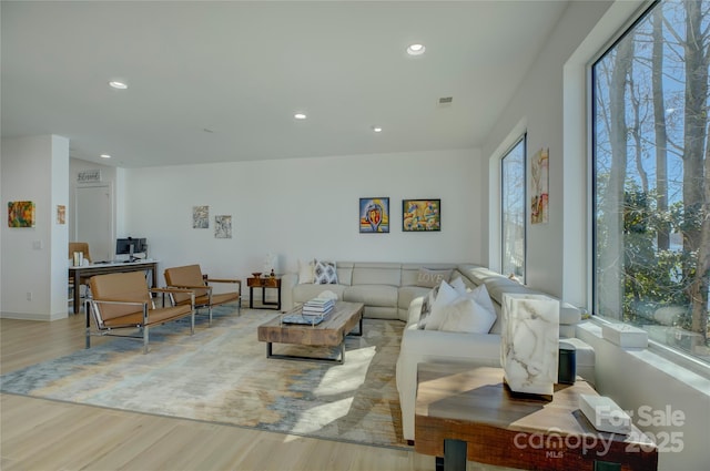 living room featuring recessed lighting and light wood finished floors