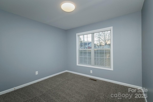 empty room featuring carpet flooring