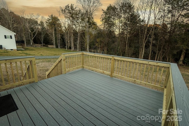 deck at dusk with a yard