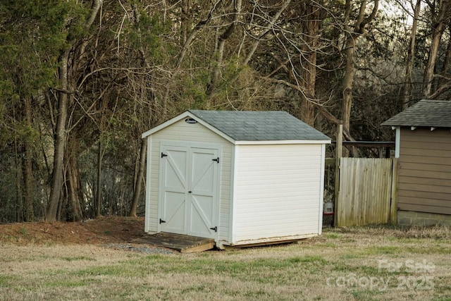 view of outbuilding featuring a lawn