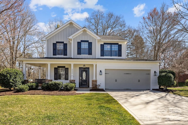 modern inspired farmhouse featuring board and batten siding, a front lawn, covered porch, driveway, and an attached garage