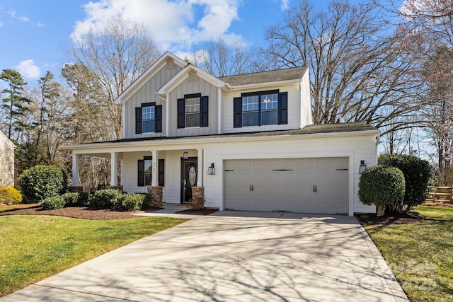 modern inspired farmhouse with a front yard, a porch, an attached garage, concrete driveway, and board and batten siding