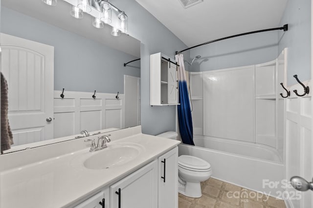 full bath with vanity, toilet, visible vents, and shower / bath combo with shower curtain