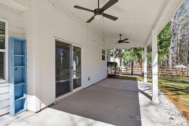 view of patio / terrace featuring fence and ceiling fan