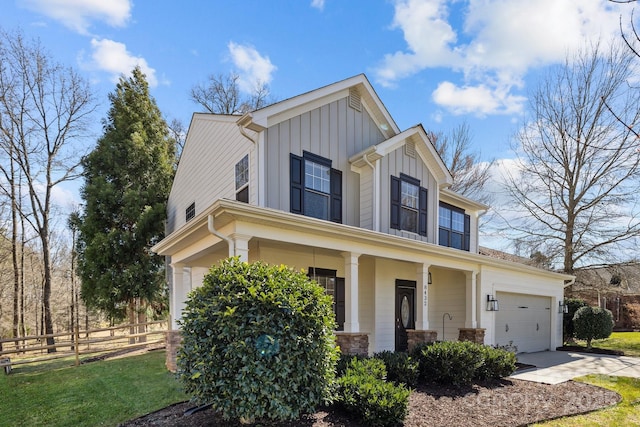 view of front of house featuring board and batten siding, fence, a porch, a garage, and driveway